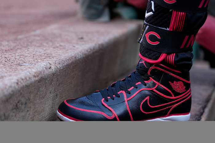 View of Jonathan India's black and red Air Jordan baseball cleats.